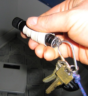 Flashlight attached to keychain.