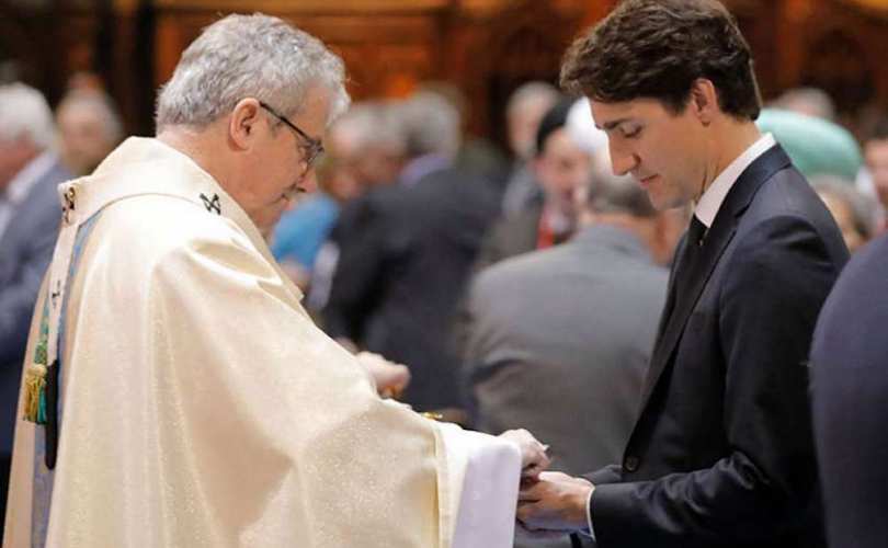 Justin Trudeau being publicly rewarded by Monsignor Christian Lpine, 2017-May-18 in Montreal.